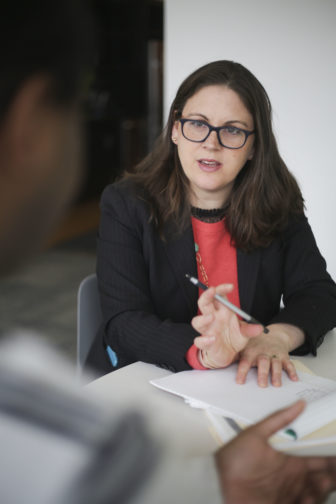 Molly Kovel, Legal Director of Civil Action Practice, speaks with a client at The Bronx Defenders office on Thursday, March 3, 2016.