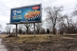 Garfield Boulevard is the northern gateway into the Englewood neighborhood but due to Norfolk Southern's rail yard expansion, the neighborhood has largely been made vacant after homes and businesses were bought out and then demolished. (Photo by Max Herman)