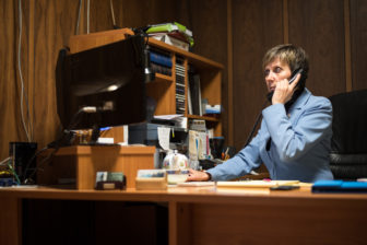 Daiva Kamberos, owner of Kamberos Insurance, helps a customer over the phone. 