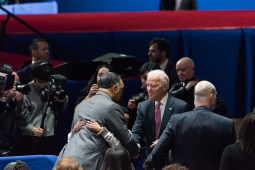 Vice President Joe Biden greets Rev. Jesse Jackson before President Obama's farewell speech.