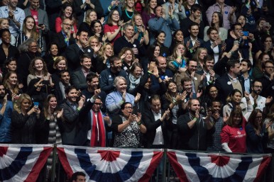 Audience members cheer President Obama's arrival on stage at McCormick Place.