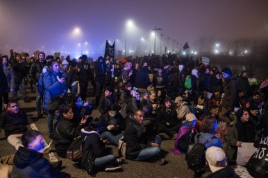 Anti-Trump protesters stage a brief sit-in on Lake Shore Drive after police stop them from marching further north on Jan. 20, 2017.