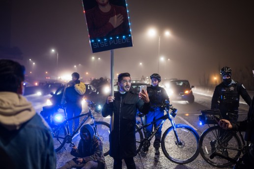 Chicago police officers stop anti-Trump protesters from marching north on Lake Shore Drive on Jan. 20, 2017.