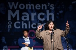 Native American writer and organizer Kelly Hayes speaks at the Women's March on Chicago, saying the day “is a moment, not a movement" and talking about the importance of taking consistent action. Behind her stands Khadine Bennett of the American Civil Liberties Union of Illinois, another speaker, who told the crowd, "When Donald Trump violates the constitution, you can be sure we'll see him in court."